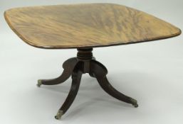An early 19th Century mahogany breakfast table, the rounded rectangular top with moulded edge,