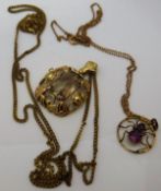 An early 20th Century 9 carat gold pendant set with two amethysts in the form of a spider housed on