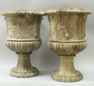 A pair of carved walnut urns IN THE MANNER OF DANIEL MAROT (1661-1752),