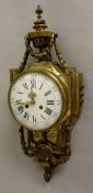 A 19th Century French brass cased cartel style wall clock in the Louis XV taste with harebell and
