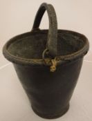 A 19th Century leather bucket of plain tapering form with stitched leather handle,
