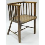 A circa 1900 stained beech stick back chair of square form,