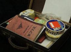 A small suitcase containing various British and World stamps