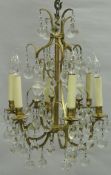 A 20th Century gilt brass and glass drop six branch electrolier CONDITION REPORTS