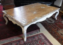 A modern pine coffee table with painted cream decoration and legs