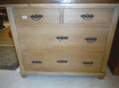 A pine chest of two short over two long drawers in the Victorian taste