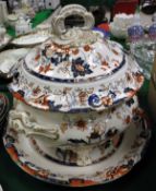 A Victorian Amherst China Imari pattern soup tureen with cover and stand, a sauce tureen and cover,