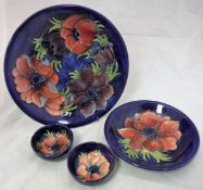 A W Moorcroft "Pansy" pattern plate on deep blue ground,