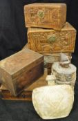 A set of three Eastern carved treen ware graduated boxes with figural decoration,