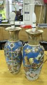 A pair of Meiji Period Japanese satsuma ware vases with ribbon and knot decorated side handles,