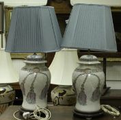 A pair of modern glazed pottery table lamps with tassle decoration,