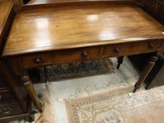 A Victorian mahogany two drawer side table with shallow raised back