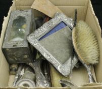 A box of various silver and plated wares to include two photograph frames,