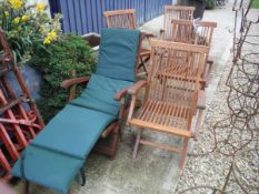 A set of four modern teak folding chairs together with a similar steamer stye chair