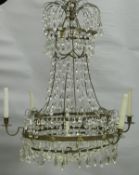 A 20th Century brass and cut glass six branch electrolier with central lights CONDITION