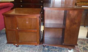Two modern mahogany revolving bookcases in the Edwardian style