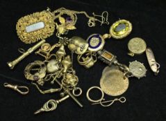 A collection of various gold coloured trinkets and jewellery including brooch, pendant, pencil,