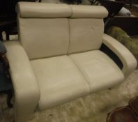 A modern cream two seat settee