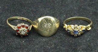 A 9 carat gold diamond and garnet set ladies dress ring,