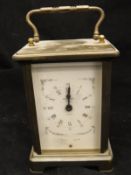 A brass cased carriage clock, the eight day movement by Ouverdrey et Bloquel,