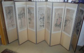 A circa 1900 Chinese ten-fold screen, each panel decorated with watercolour studies of birds,