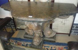 A painted pier table in the Rococo taste, the simulated marble top with carved frieze,