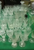 A collection of various glassware to include cut and other glass drinking glasses, decanter,