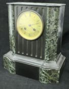 A Victorian black slate and green marble cased mantle clock,