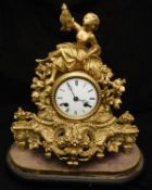 A 19th Century French gold painted spelter cased mantle clock,