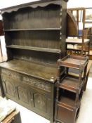 A 20th Century oak dresser, mahogany three tier whatnot with cupboard door, two oak coffers,