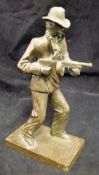A 20th Century bronze figure of a gangster (or possibly FBI agent) with Tommy gun,