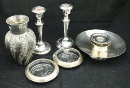 A modern silver stand, two silver candle drip trays,
