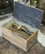 An early 20th Century (circa 1925) stained pine woodworker's chest and contents of various hand