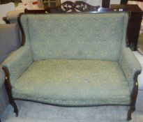 A Victorian mahogany two seat sofa with show frame and carved and pierced top rail,