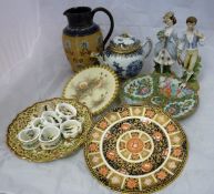 A Chinese blue and white and gilt decorated teapot, a famille rose plate,