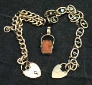 A 9 carat gold chain link bracelet with heart shaped padlock clasp,