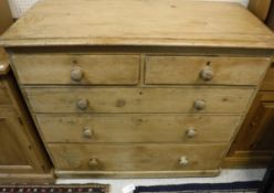 A Victorian pine chest of drawers, the plain top above two short and three long drawers,