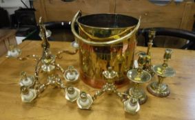 A copper bound brass coal bucket, a pair of brass candle lamps,