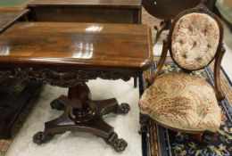 A William IV rosewood card table, the rounded rectangular fold-over top with moulded edge,