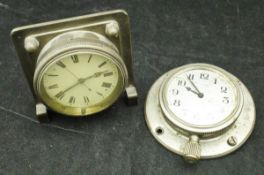 A vintage car clock in white metal case, the silvered dial with Arabic numerals,