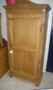 A pine single door armoire CONDITION REPORTS Small chips and scratches and scuffs