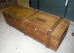 A pine chest with iron end carrying handles,