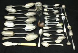 A collection of various silver spoons to include three pairs of tablespoons,
