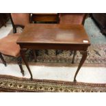 An early 20th Century mahogany card table on cabriole legs