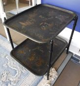 A 20th Century chinoiserie decorated two tier table as two trays with printed decoration on a