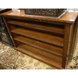 A late Victorian mahogany open bookcase with adjustable shelving on a plinth base