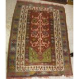 A Kelim prayer rug, the central panel set with stylised tarantula design on a red ground,