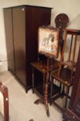 A Victorian rosewood pole screen, the panel decorated with a spaniel seated upon a needlework stool,