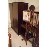 A Victorian rosewood pole screen, the panel decorated with a spaniel seated upon a needlework stool,