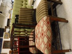 A green button back headboard and four assorted chairs,